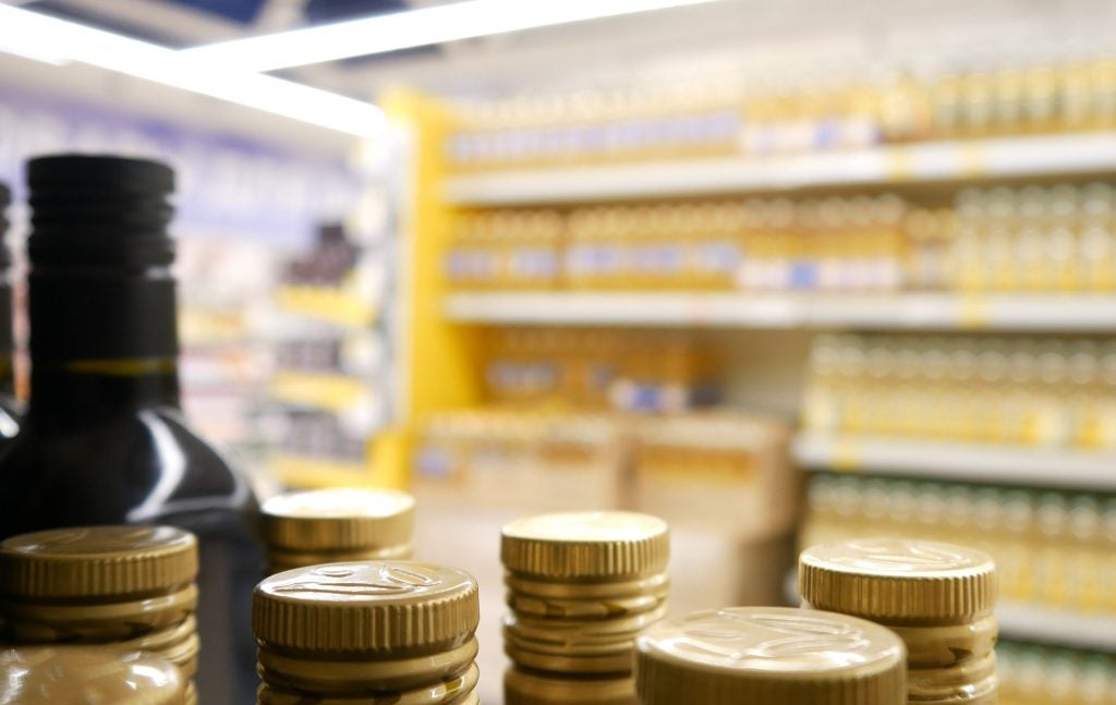 Close-up of olive-oil bottles on shelf